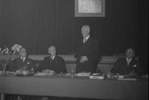 Chairing a meeting in 1955